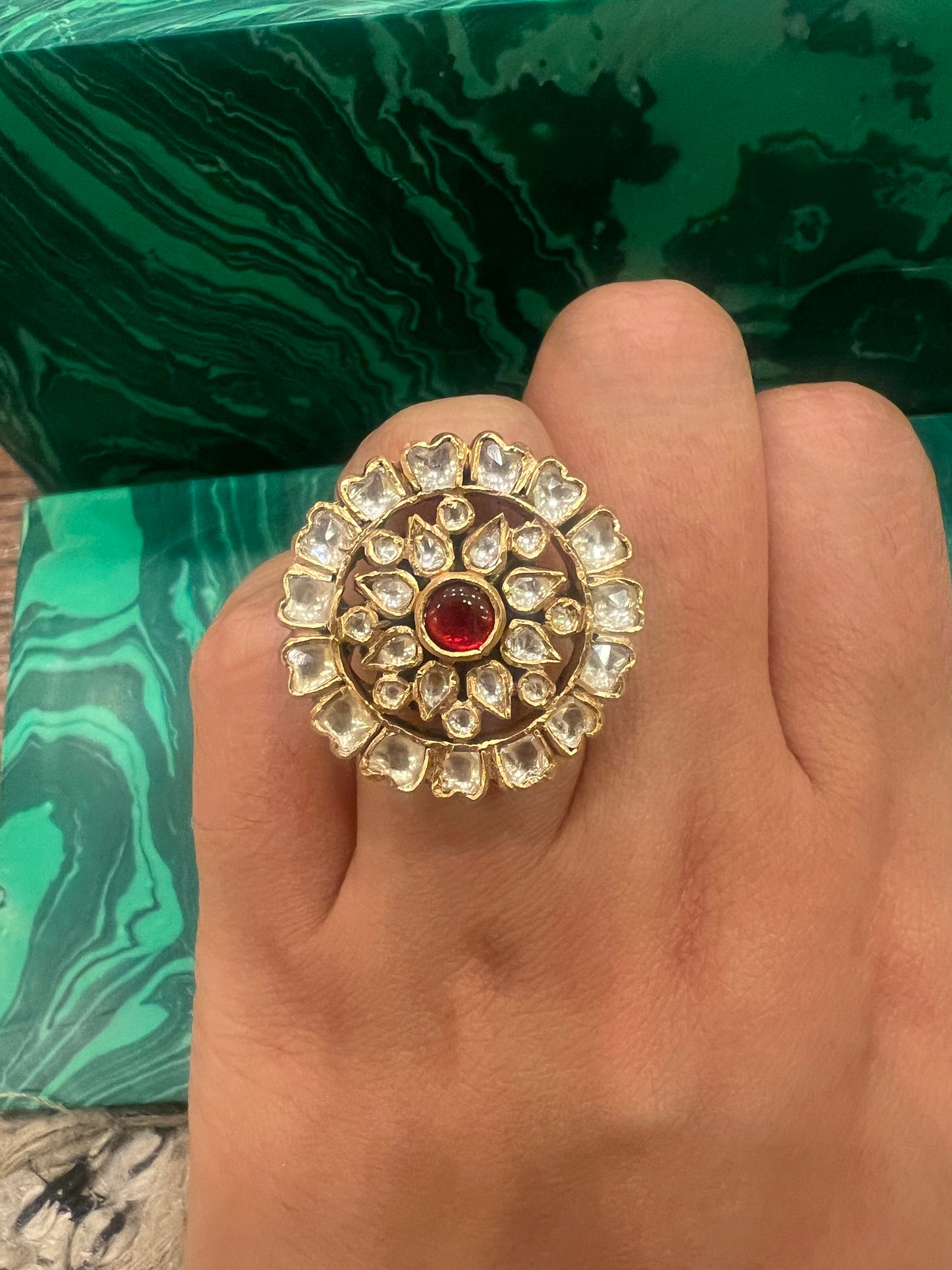 Small round ruby floral ring