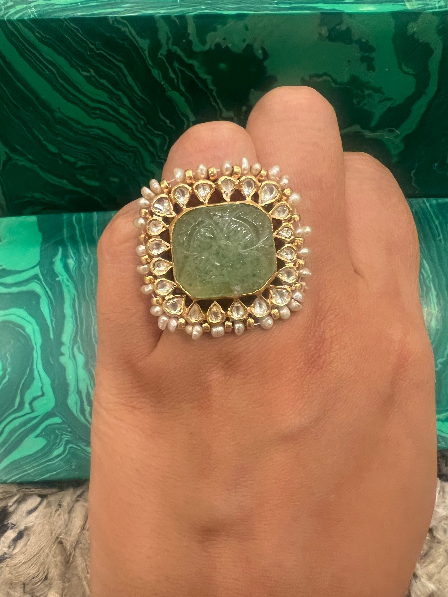 Carved emerald ring