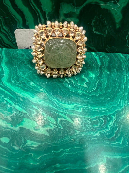 Carved emerald ring